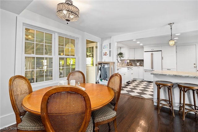 dining area featuring dark hardwood / wood-style flooring and sink