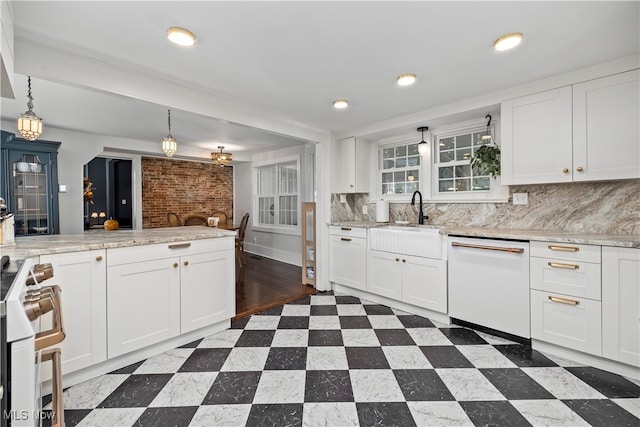 kitchen featuring white cabinetry, white appliances, and hanging light fixtures