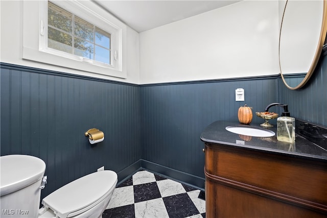 bathroom featuring vanity and toilet