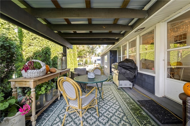 wooden terrace featuring a grill