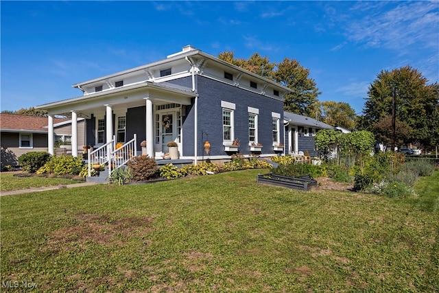 view of front of house with covered porch and a front lawn