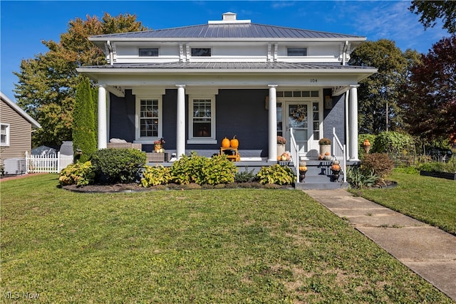 view of front of house with a porch and a front lawn