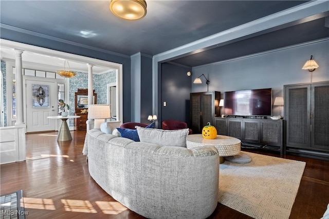 living room with ornamental molding, dark hardwood / wood-style flooring, and decorative columns