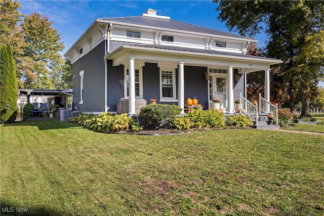 view of front facade featuring a front yard and a porch