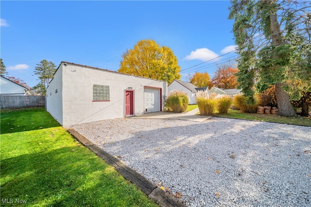 garage featuring a yard