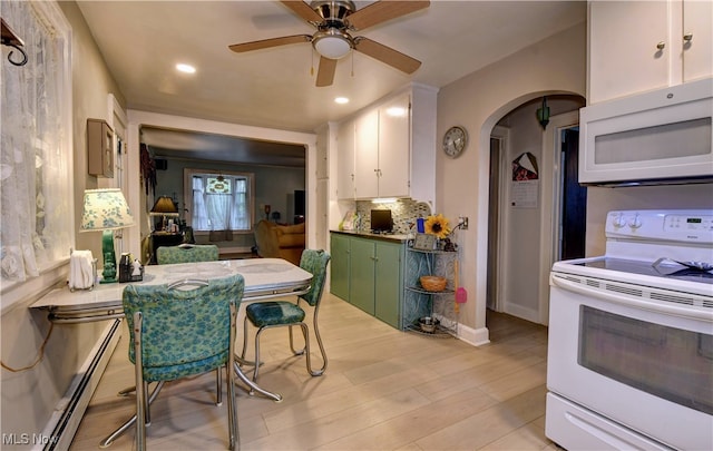 kitchen with white cabinetry, light wood-type flooring, white appliances, and a baseboard heating unit