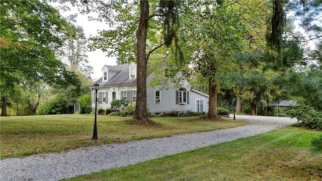 view of side of property featuring a yard