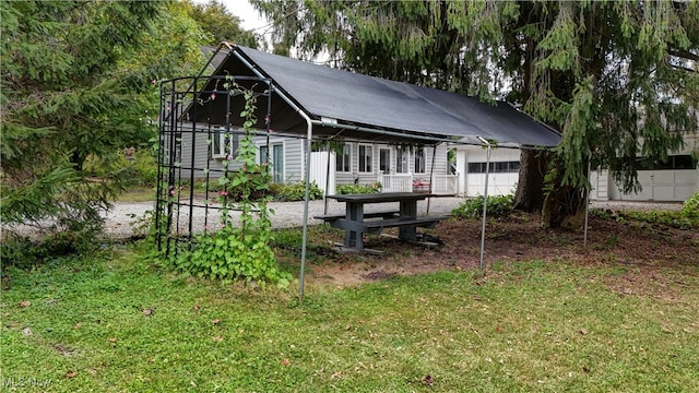 rear view of house with a garage