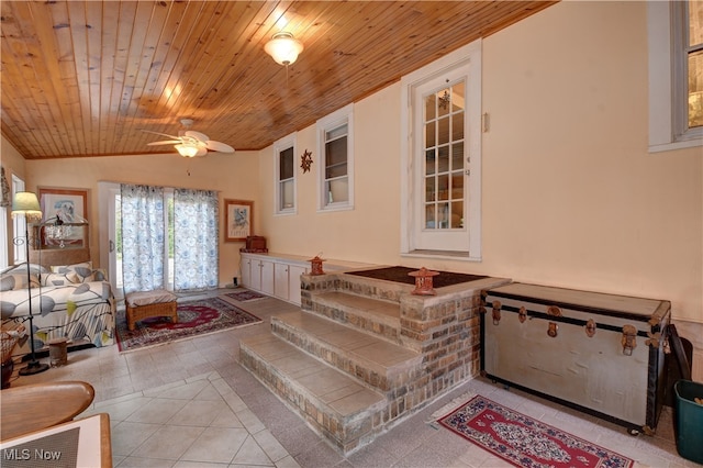 interior space featuring ceiling fan