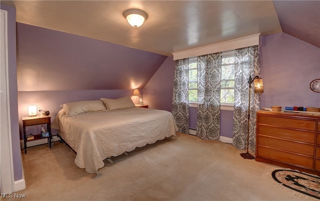 carpeted bedroom featuring a baseboard radiator and lofted ceiling