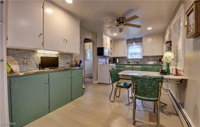 kitchen with white cabinets, ceiling fan, baseboard heating, tasteful backsplash, and white electric range oven