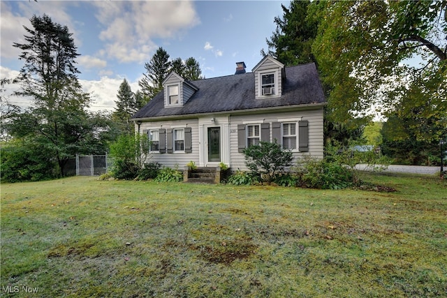 cape cod-style house featuring a front lawn