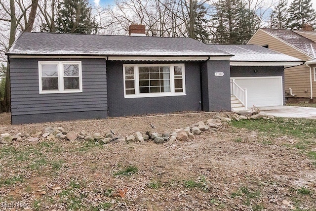 ranch-style house featuring a garage