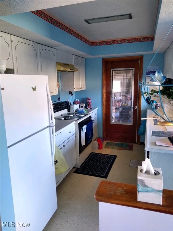 kitchen with white cabinetry, range hood, and white appliances