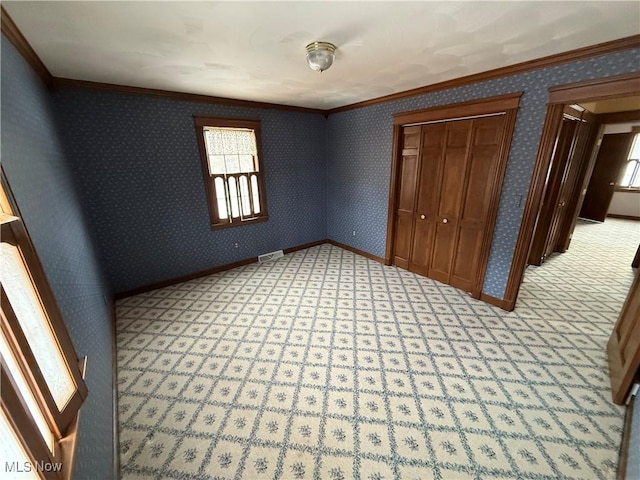 7917 Columbiana Canfield Rd, Canfield, OH 44406 - unfurnished bedroom featuring ornamental molding, a closet, and baseboards