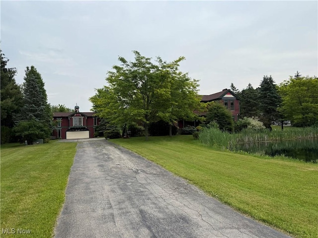 7917 Columbiana Canfield Rd, Canfield, OH 44406 - obstructed view of property featuring asphalt driveway and a front lawn