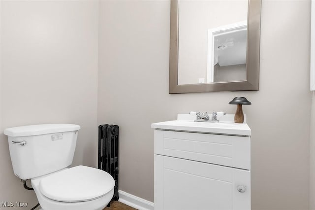 3781 Washington Blvd, University Heights, OH 44118 - half bath featuring radiator, vanity, toilet, and baseboards