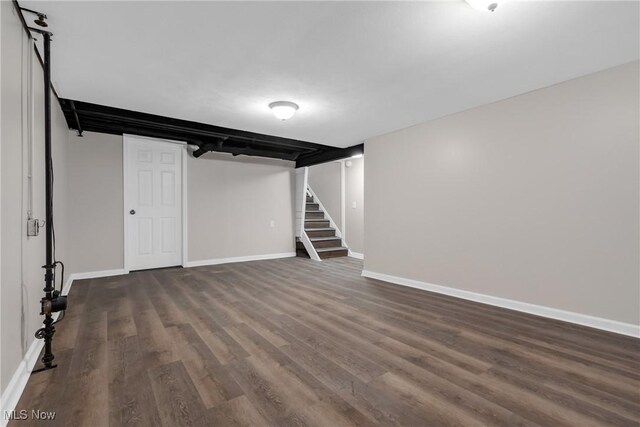 basement featuring dark hardwood / wood-style floors