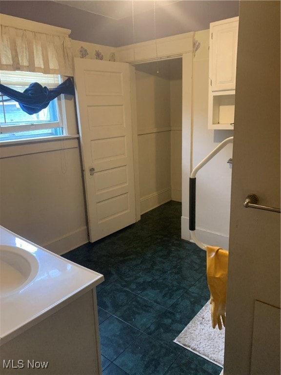 bathroom featuring sink and tile patterned flooring