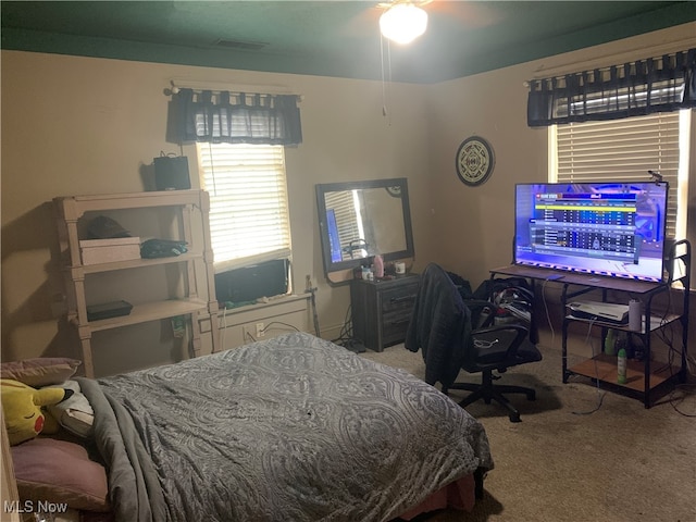 carpeted bedroom featuring ceiling fan