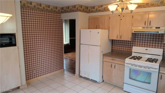 kitchen with light brown cabinetry, white appliances, and light tile patterned flooring