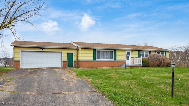 single story home with a front lawn and a garage