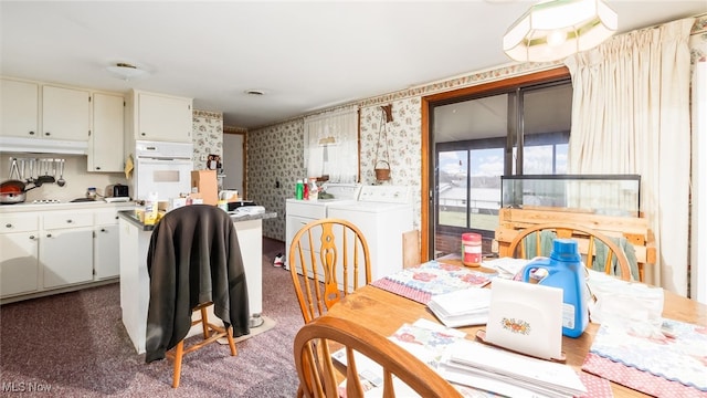 carpeted dining space with washer and clothes dryer