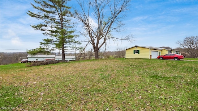 view of yard featuring a garage