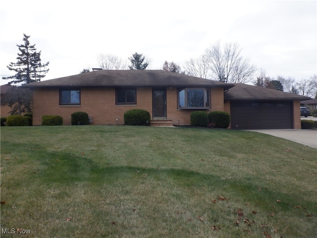 single story home with a front yard and a garage