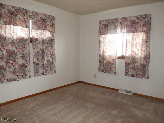 spare room featuring carpet flooring