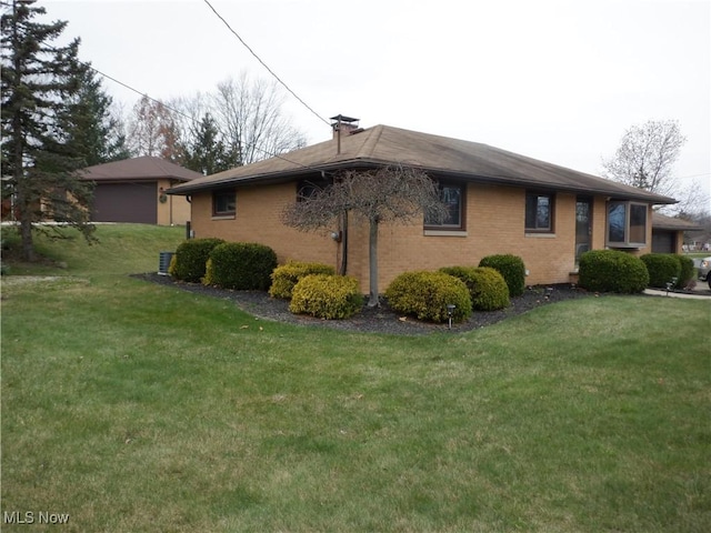 view of home's exterior with a yard