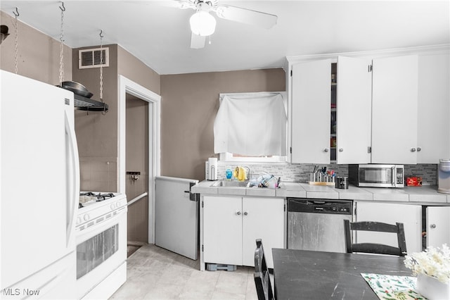 kitchen with white cabinetry, sink, and appliances with stainless steel finishes