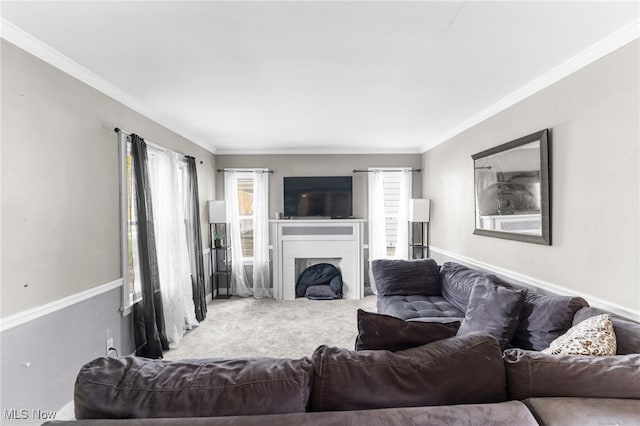 living room featuring a fireplace, carpet floors, and ornamental molding