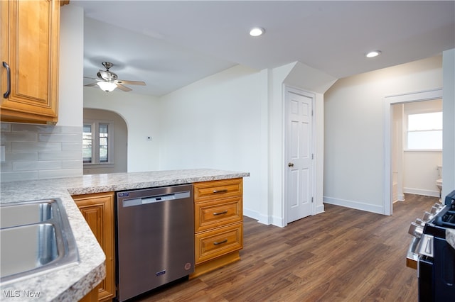 kitchen featuring dark hardwood / wood-style flooring, ceiling fan, plenty of natural light, and appliances with stainless steel finishes