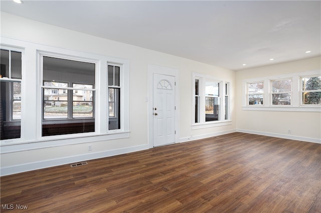 interior space with dark wood-type flooring