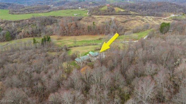 birds eye view of property featuring a rural view