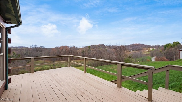 wooden deck featuring a yard