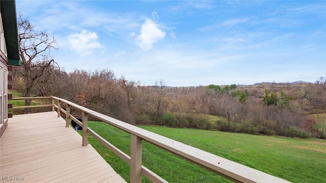 wooden terrace with a yard