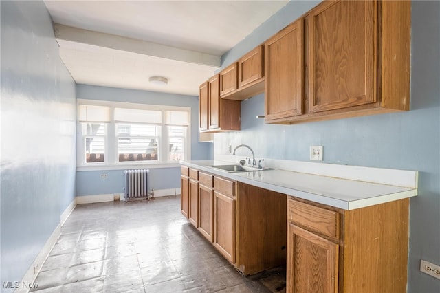 kitchen with radiator heating unit and sink