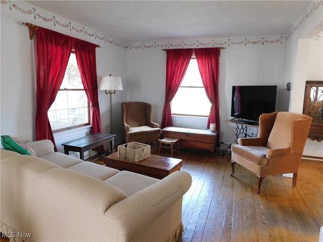 living area with hardwood / wood-style floors