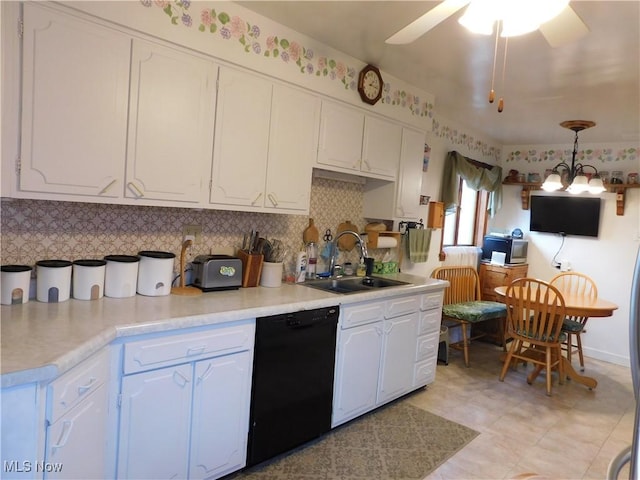 kitchen featuring a sink, black dishwasher, white cabinetry, decorative backsplash, and light countertops