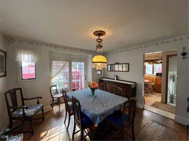 dining area featuring hardwood / wood-style floors