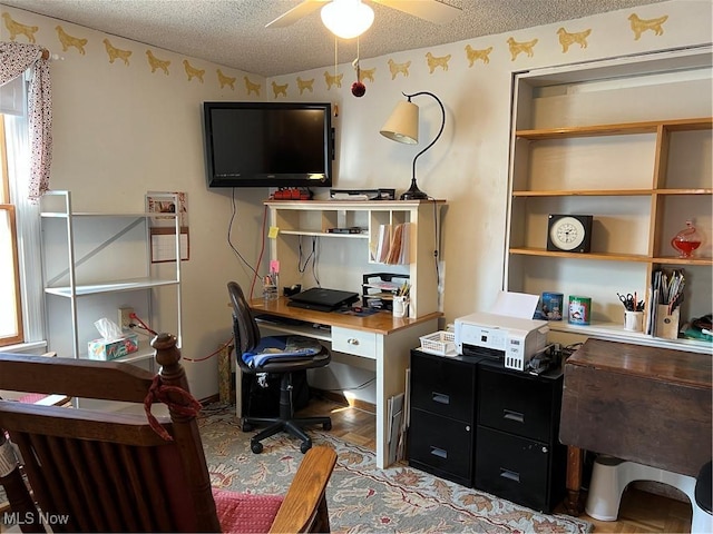 office area featuring a textured ceiling and a ceiling fan