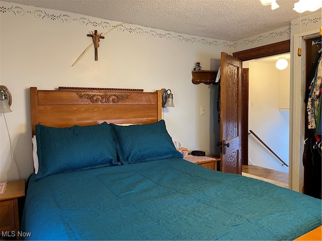 bedroom featuring a textured ceiling