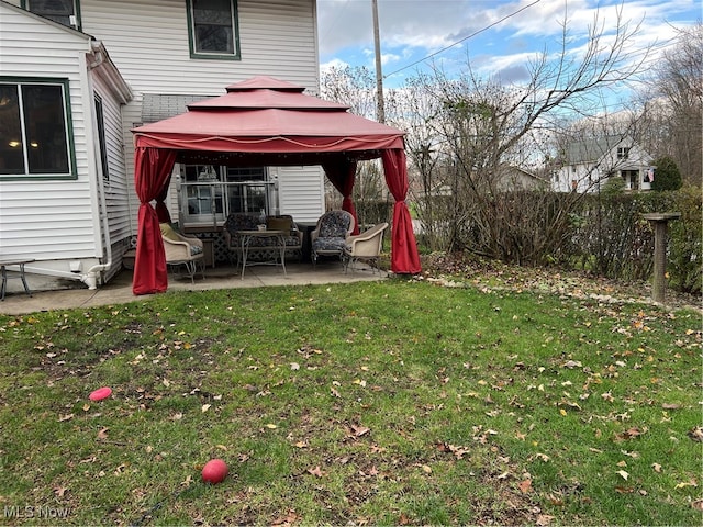 view of yard featuring a gazebo and a patio area