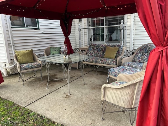 view of patio / terrace featuring a gazebo and an outdoor living space