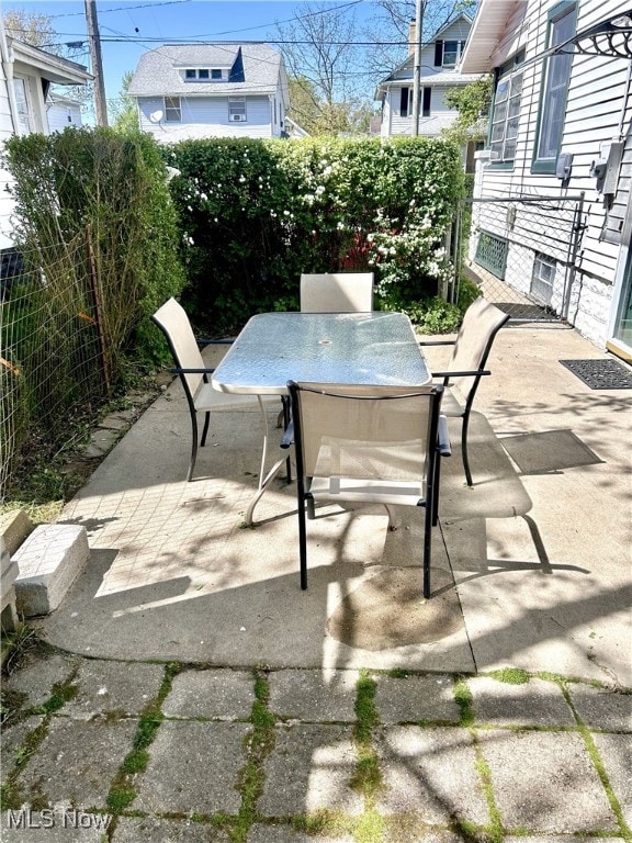 view of patio / terrace with outdoor dining space and a fenced backyard