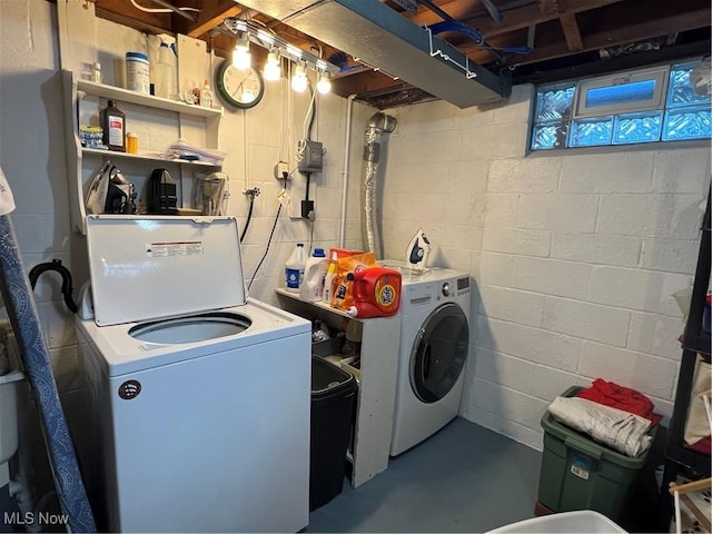 laundry room featuring washing machine and clothes dryer