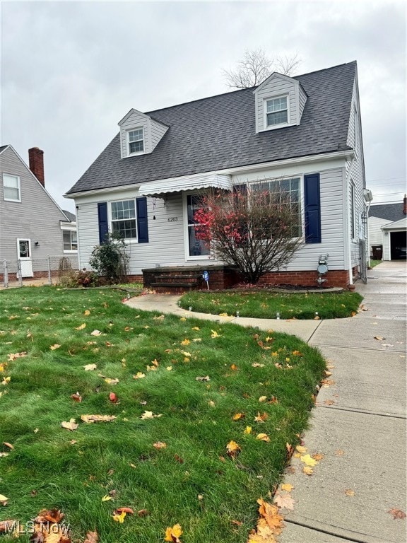 cape cod-style house with a front yard