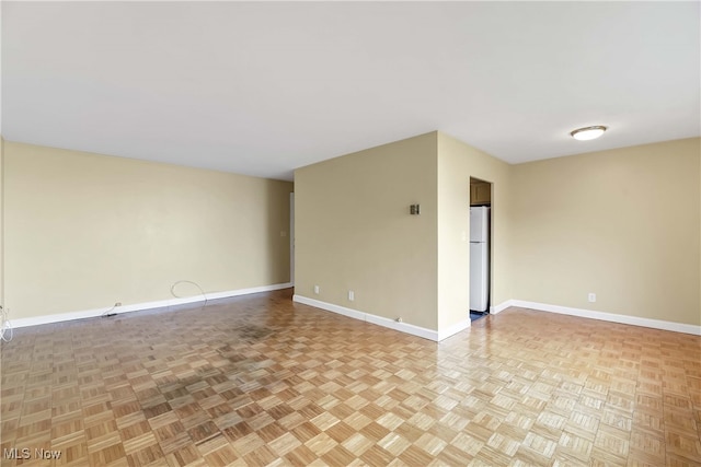 empty room with light parquet floors